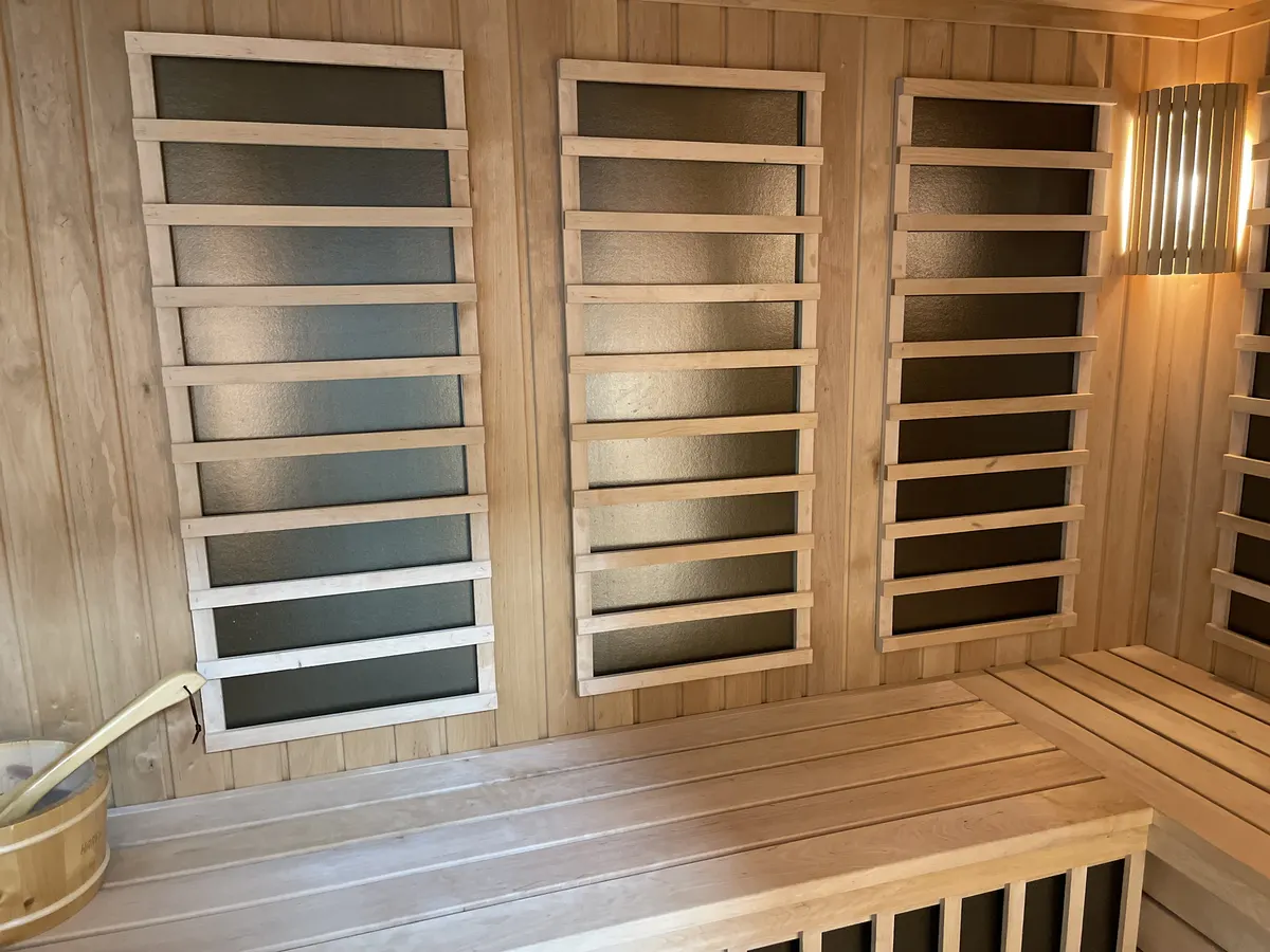 Sauna benches and backrest panels in light wood